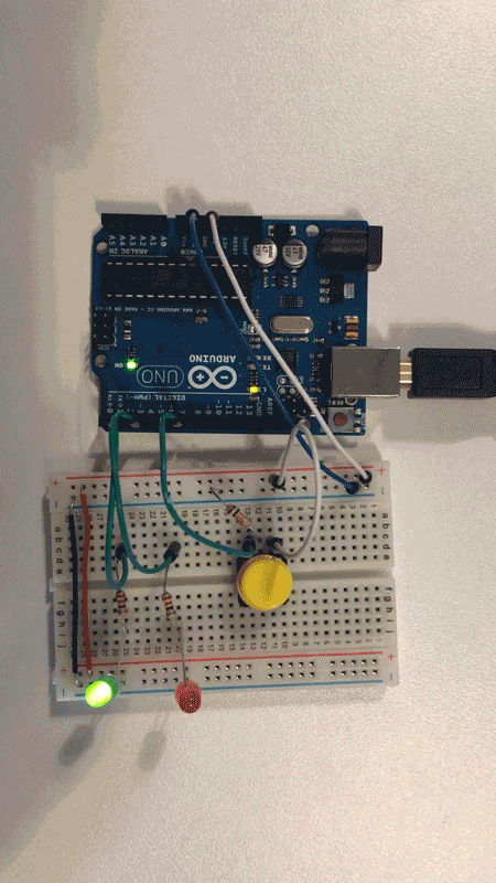 Switching between green and red LEDs using the push button